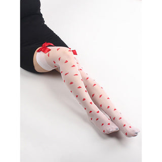 White thigh-high socks with red heart pattern worn by a person on a white background
